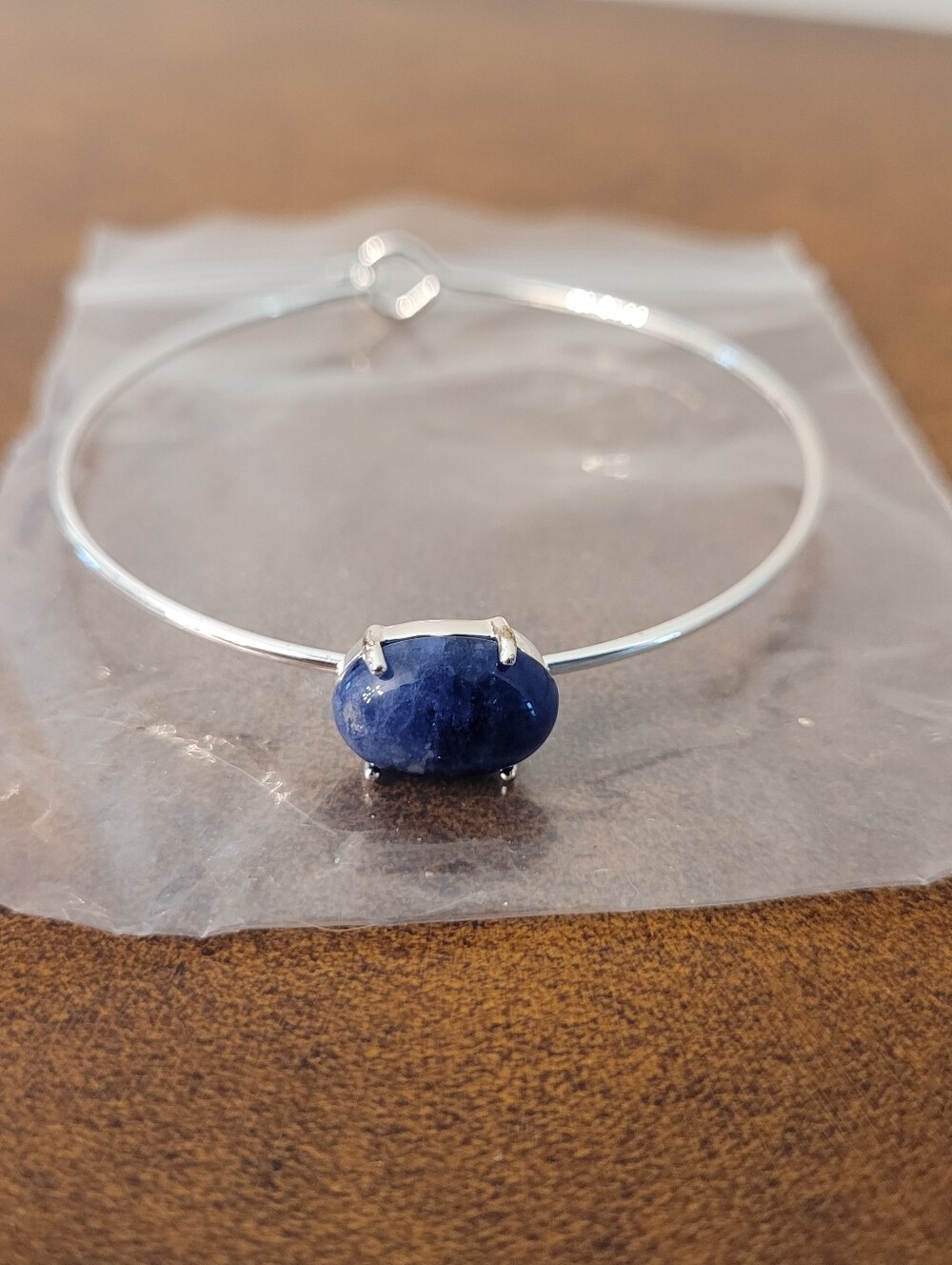 Silver Bangle Bracelet with Blue Stone Accent
